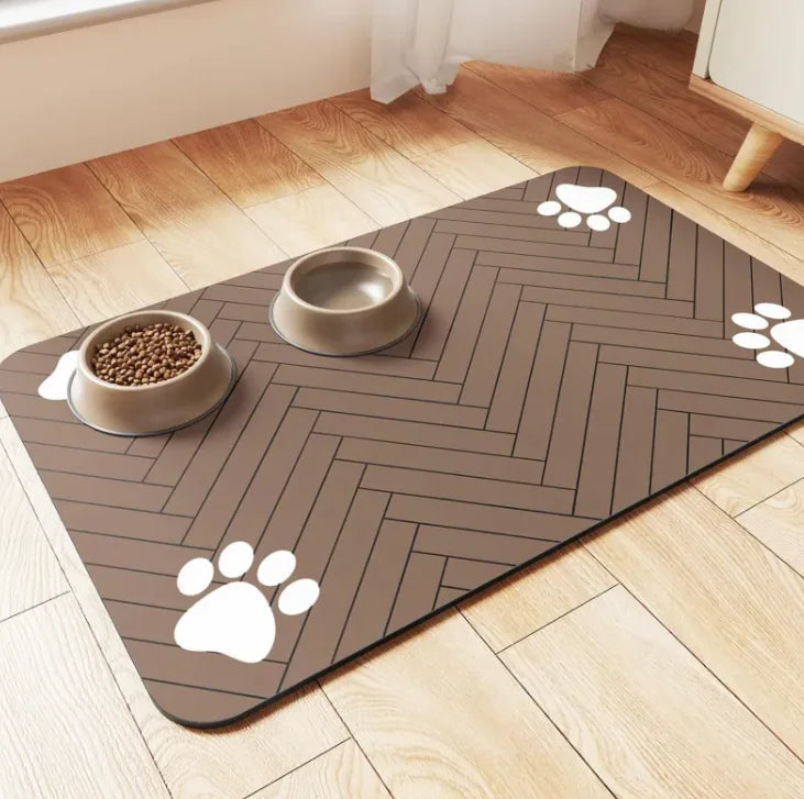Pet mat with herringbone pattern and paw prints on a wooden floor